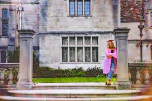 celebrate this milestone with her and she wears a pink cap and gown