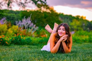perfectly posed a senior photoshoot captures expert lighting and colors abound with the flowers