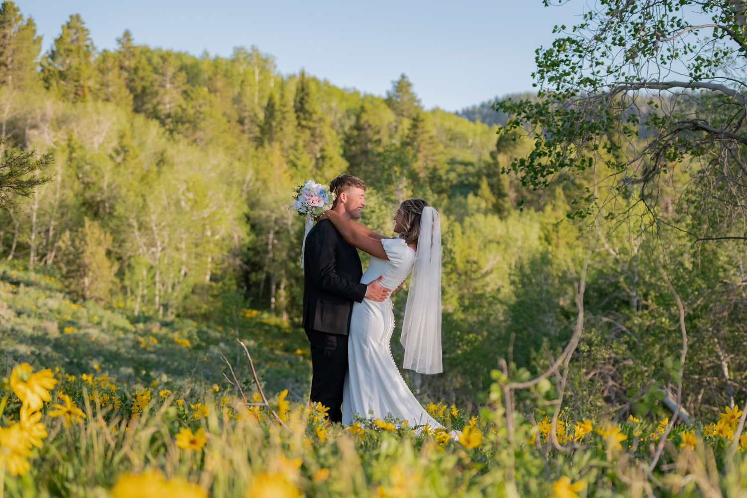 Bridal wedding photos in a field of wildflowers in Wyoming