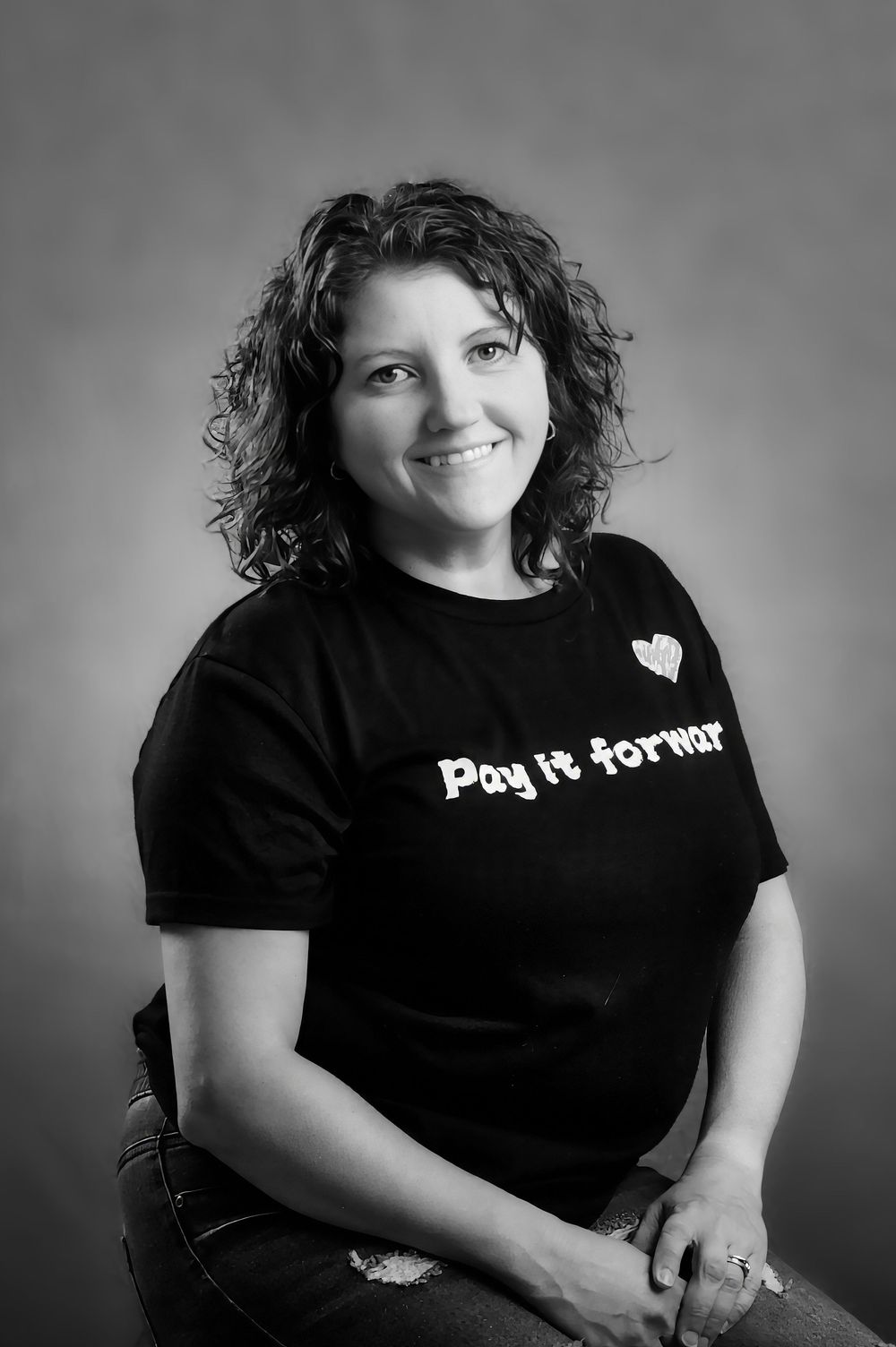 Black and white portrait series showing a figure in dark t-shirt posing against a simple background.