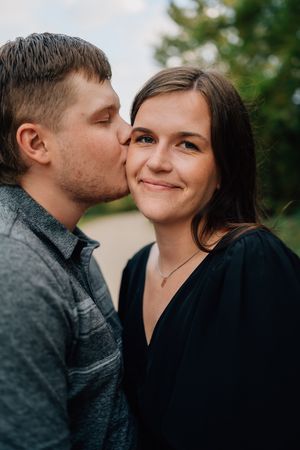 An intimate outdoor portrait of a couple sharing a sweet moment.