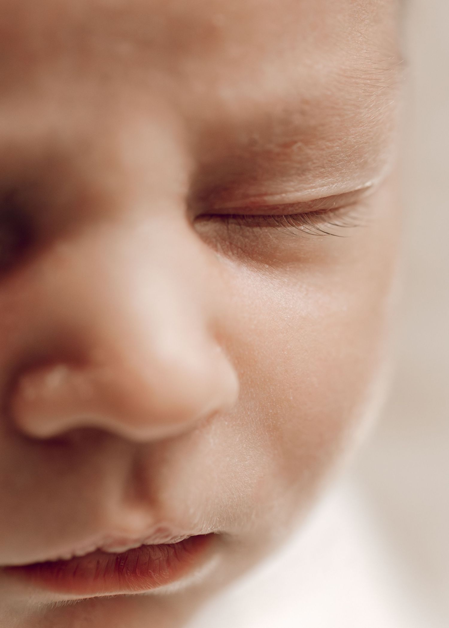 Close-up black and white photograph of tiny newborn baby feet with delicate wrinkles and toes. Fresh 48 photography, Townsville.