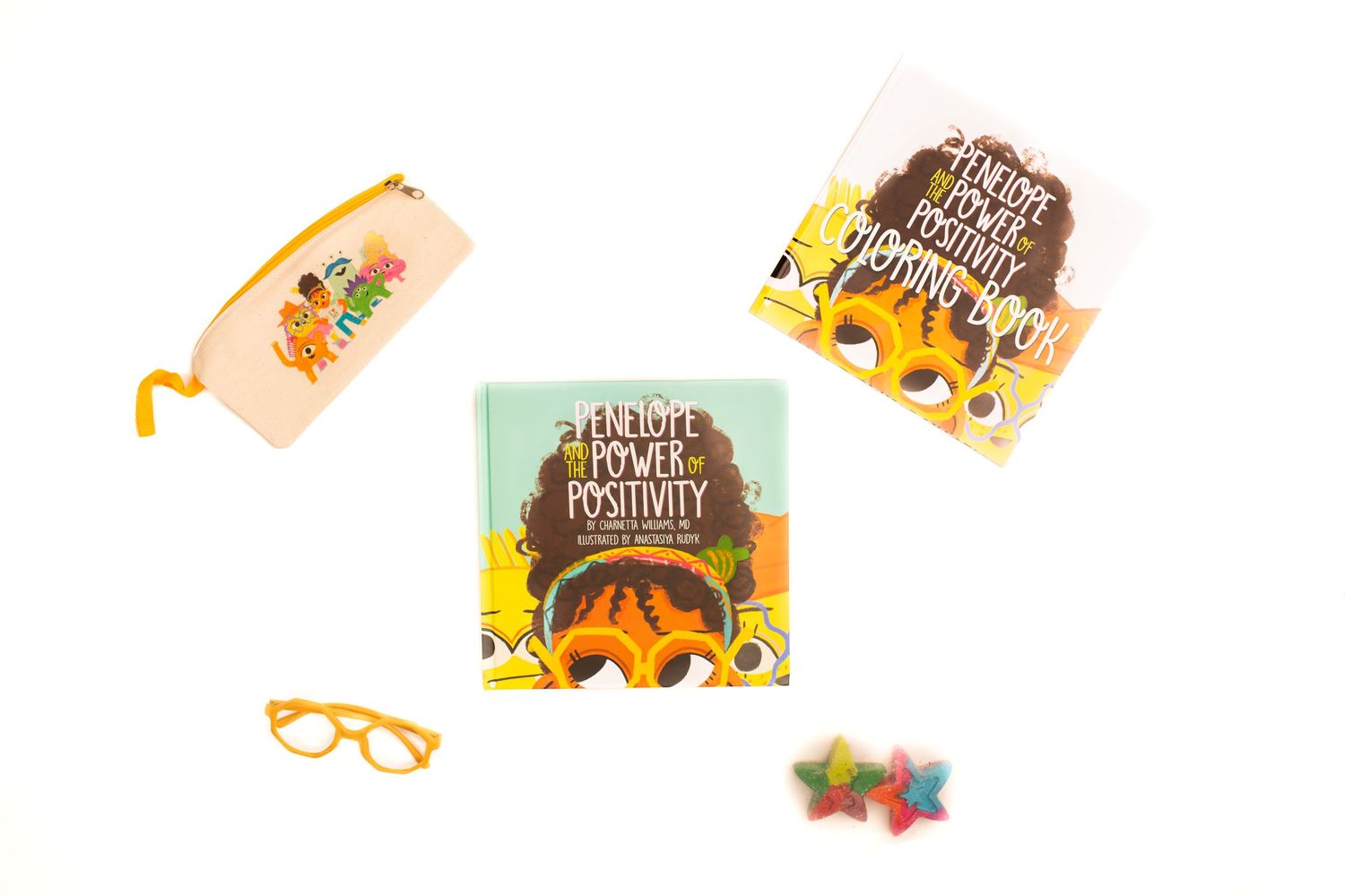 Flat lay of book cover with sunflower design alongside orange glasses and accessories.