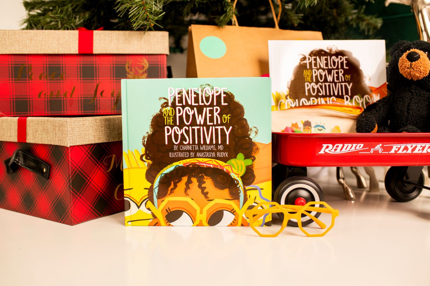 Holiday themed display with books, plaid boxes, and sunflower designs.