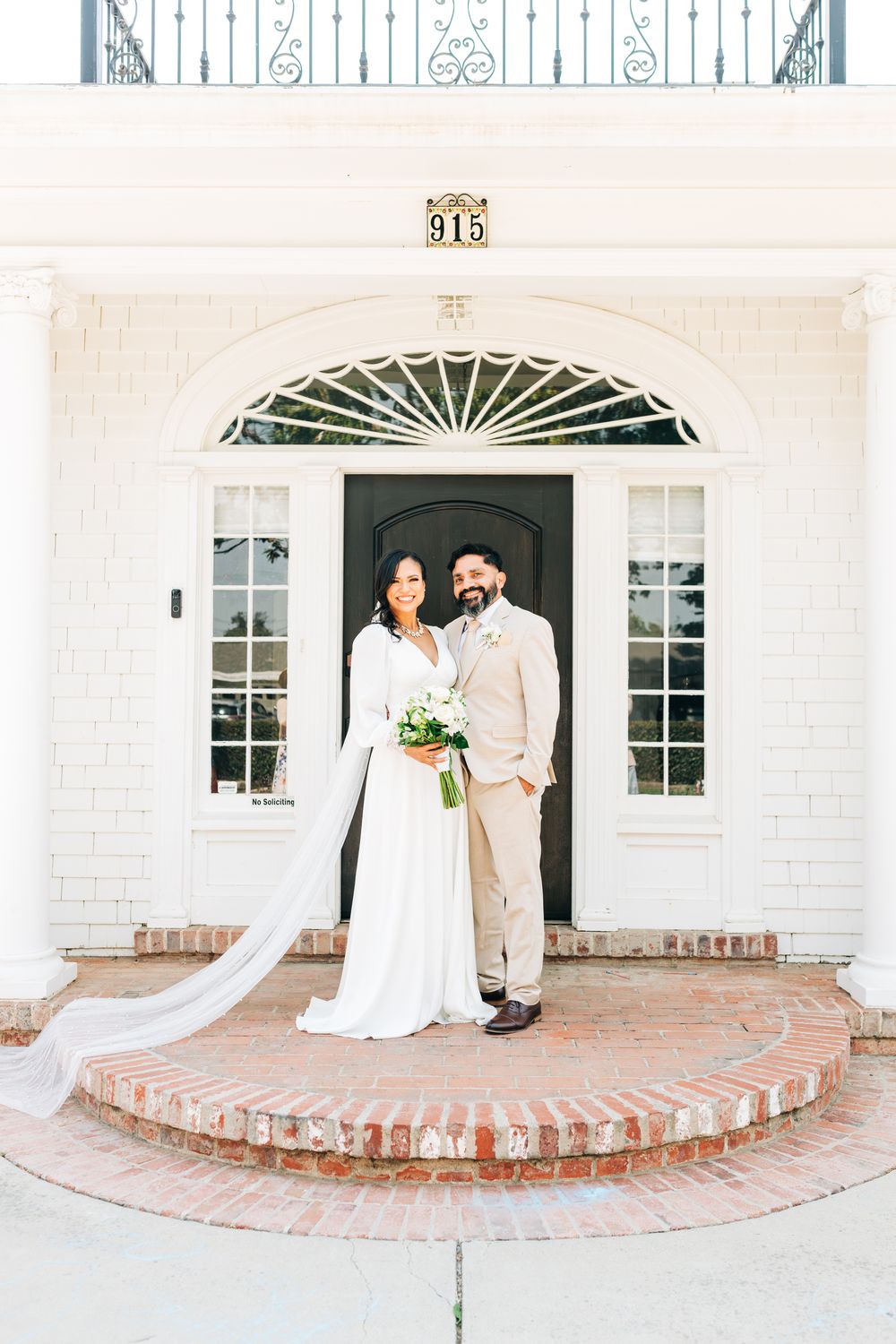Bride and groom standing on a beautiful plantation porch, Santa Maria, CA
