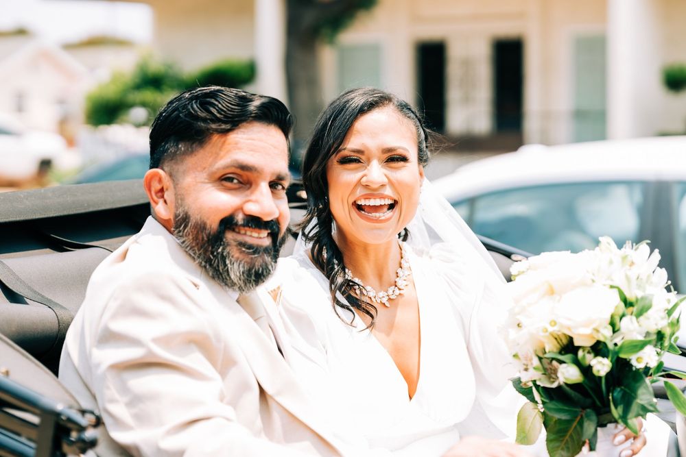 Newly married bride and groom in their getaway car, Santa Maria, CA