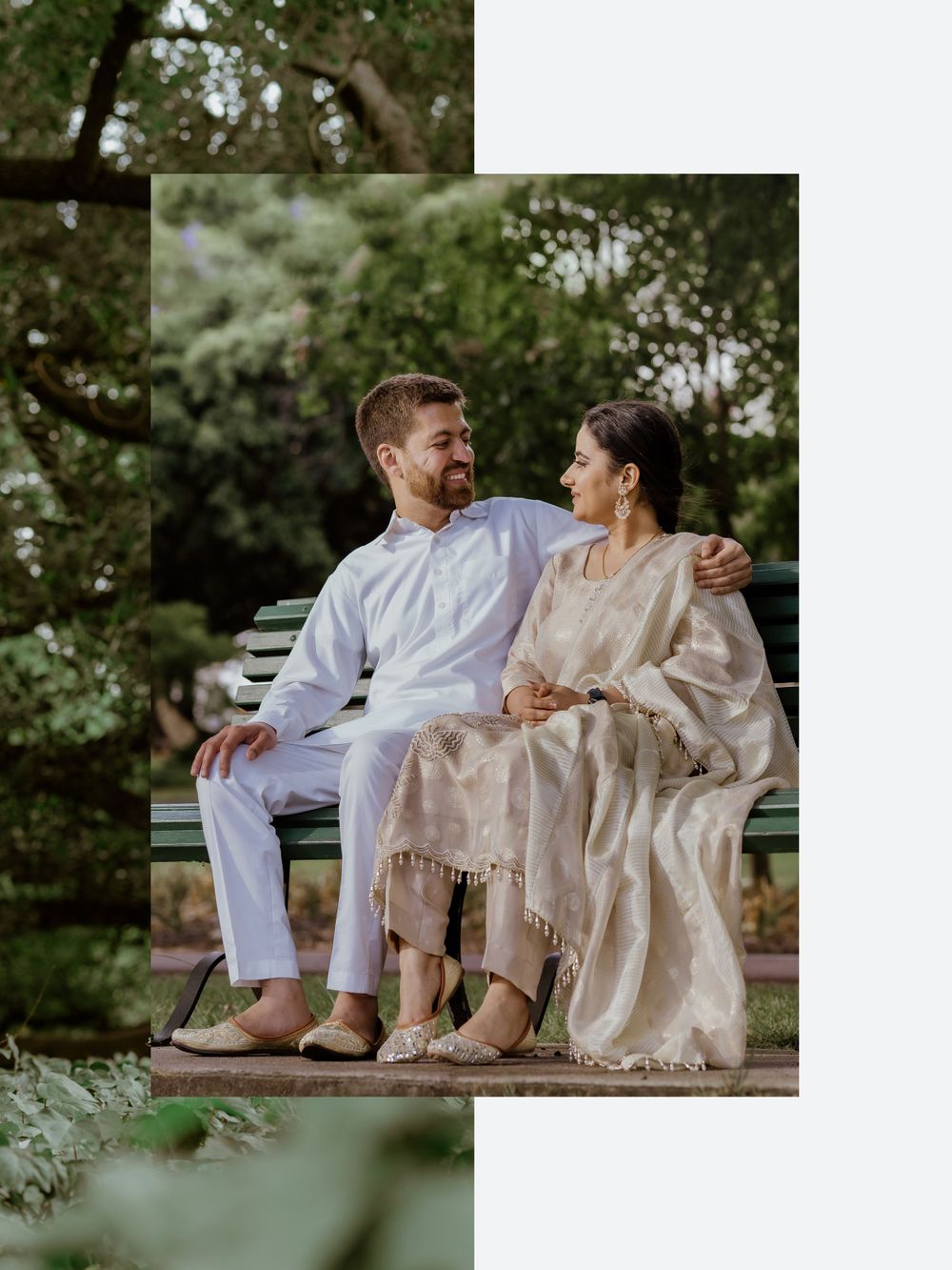 A couple sitting together on a white garden bench, wearing coordinated white outfits in a lush garden setting.