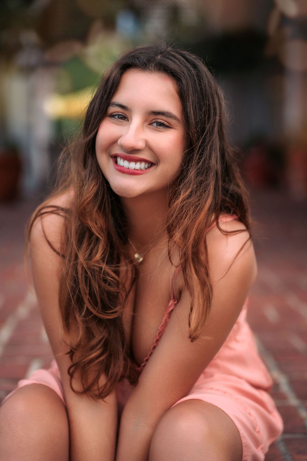A sequence of similarly styled portraits in warm lighting showing peach clothing and brown hair.