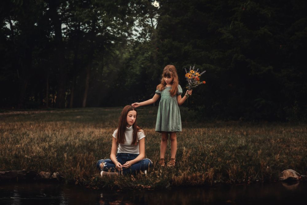 A moody sequence of nature photos showing people exploring wooded areas in soft, dark lighting.
