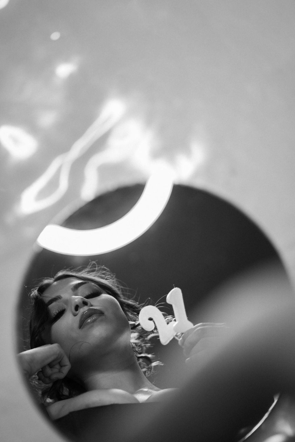 A series of black and white profile shots showing someone reclining in a dramatic lighting setup.