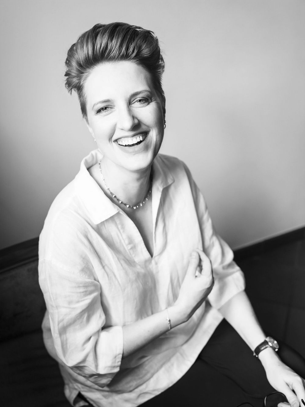 A woman laughing.