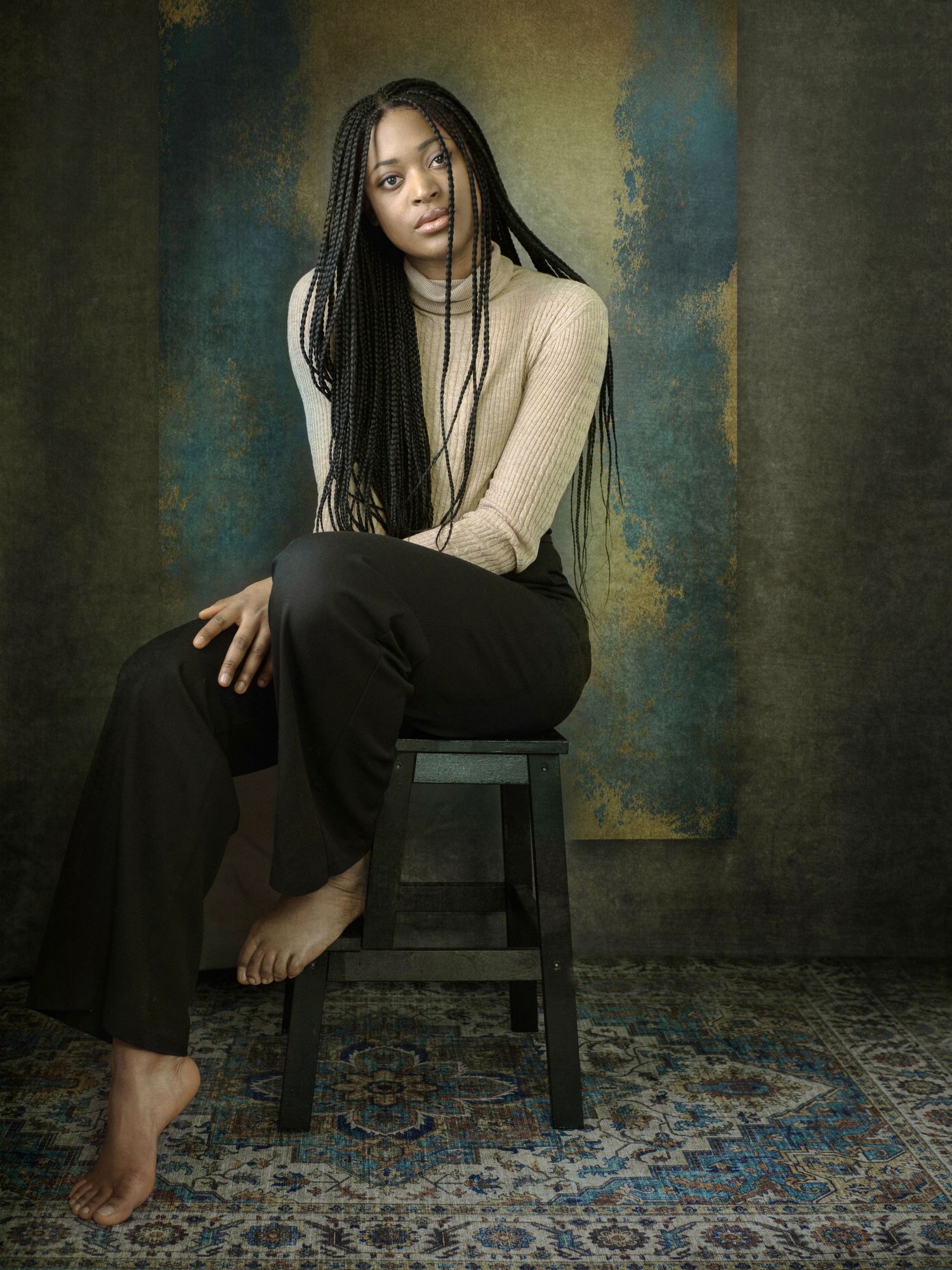 Dramatic portrait series showing someone seated on a dark chair against textured wall with ornate carpet below.