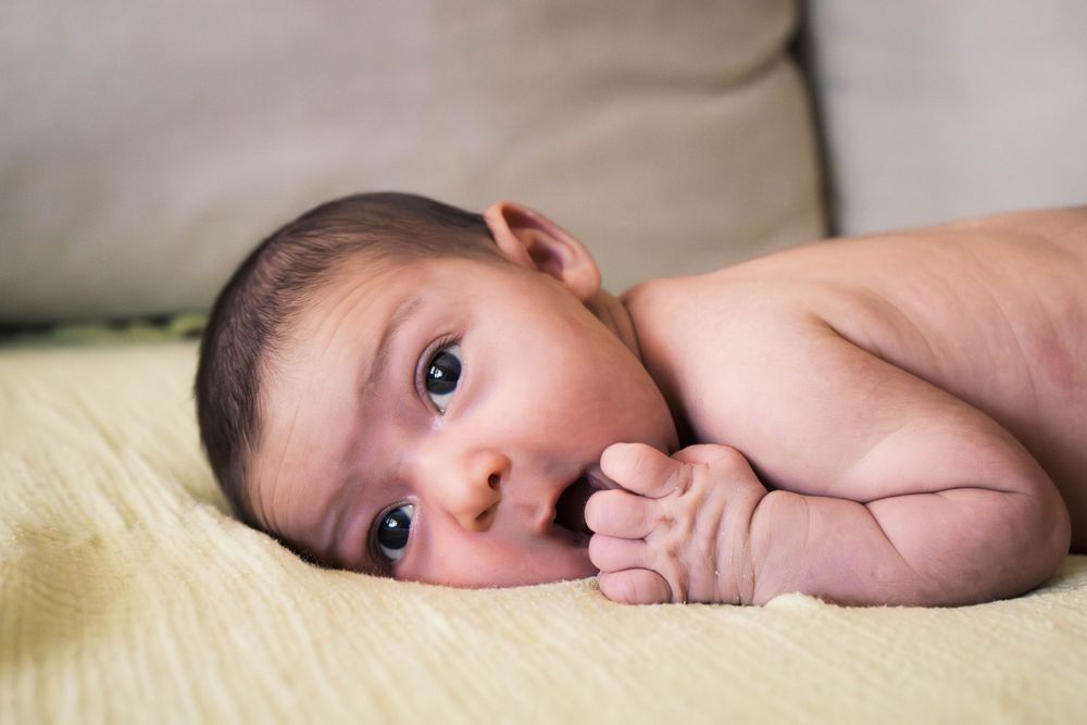 In-home newborn sessions designed to reflect your unique family story with warmth and intimacy.