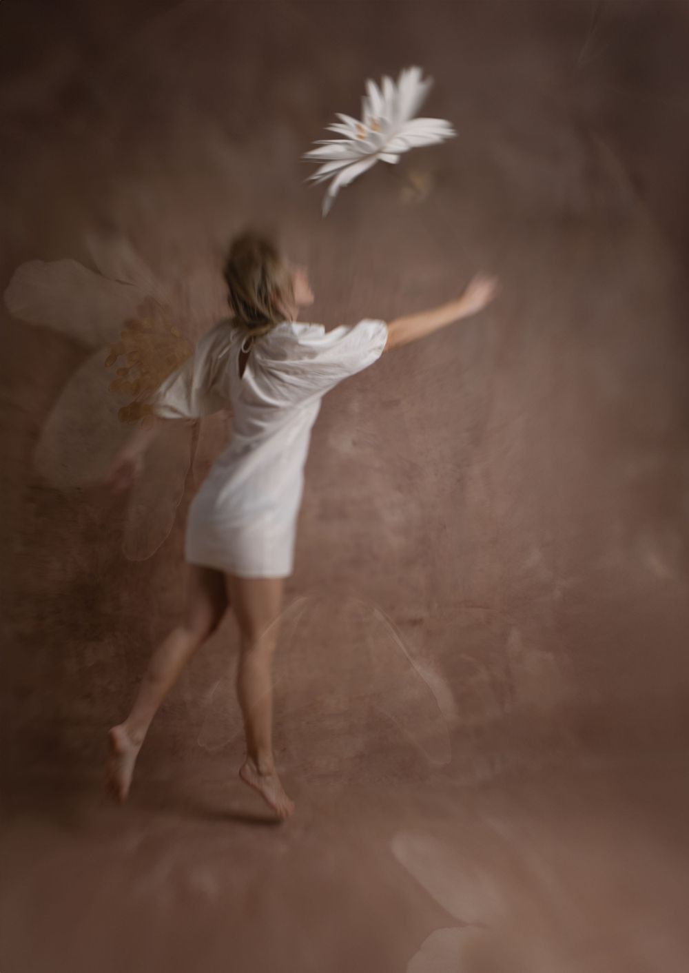 woman chasing flower