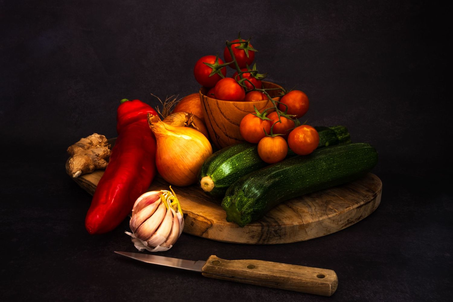 Old Master style image of vegetables on a wooden board
