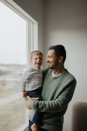 Dad holding his son and laughing in Carmel, Indiana