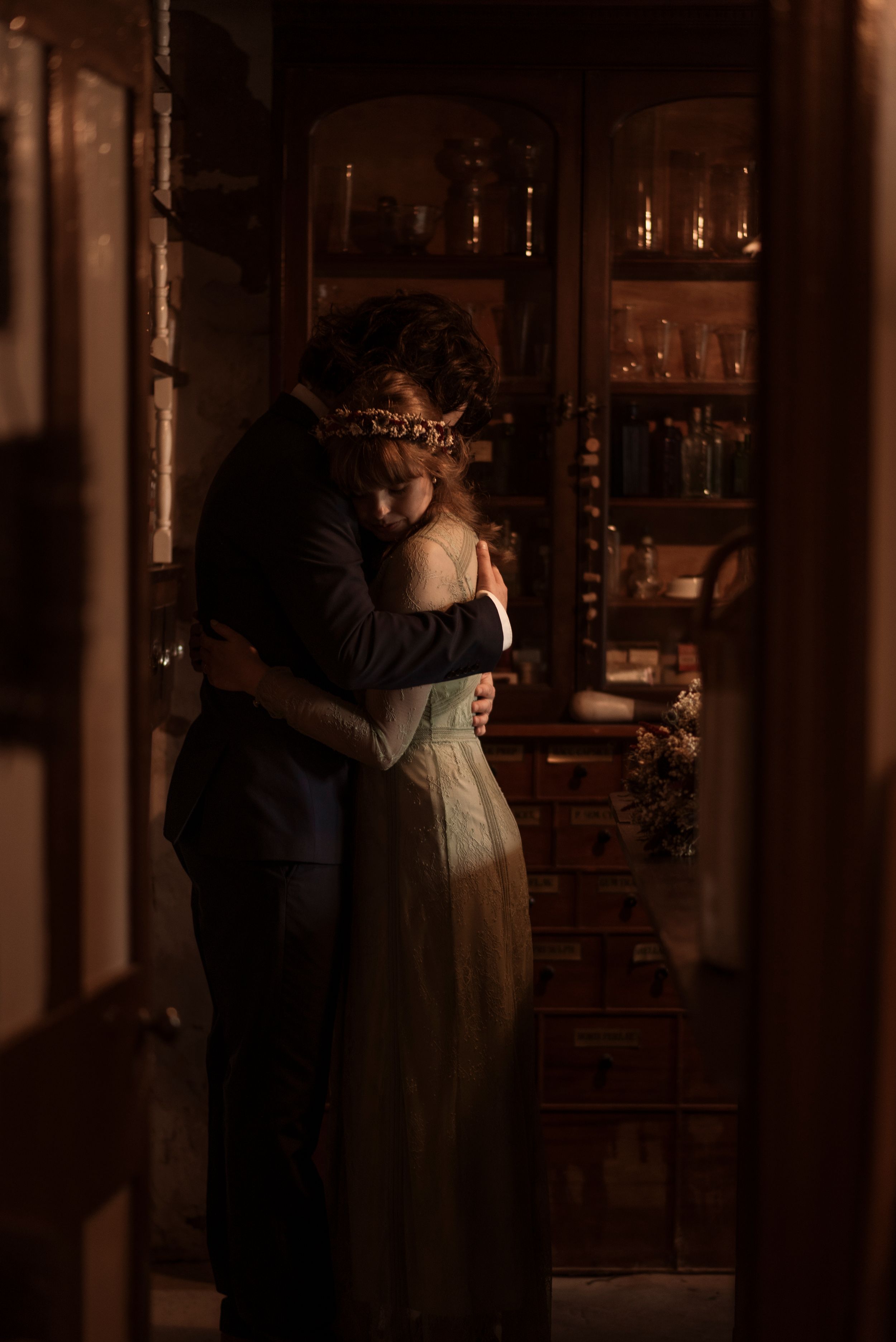 Intimate portrait of a bride and groom holding each other in the beautiful setting of Ryedale folk museum