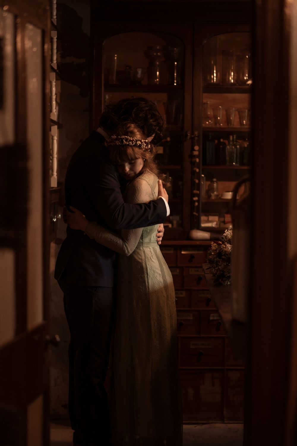 Intimate portrait of a bride and groom holding each other in the beautiful setting of Ryedale folk museum