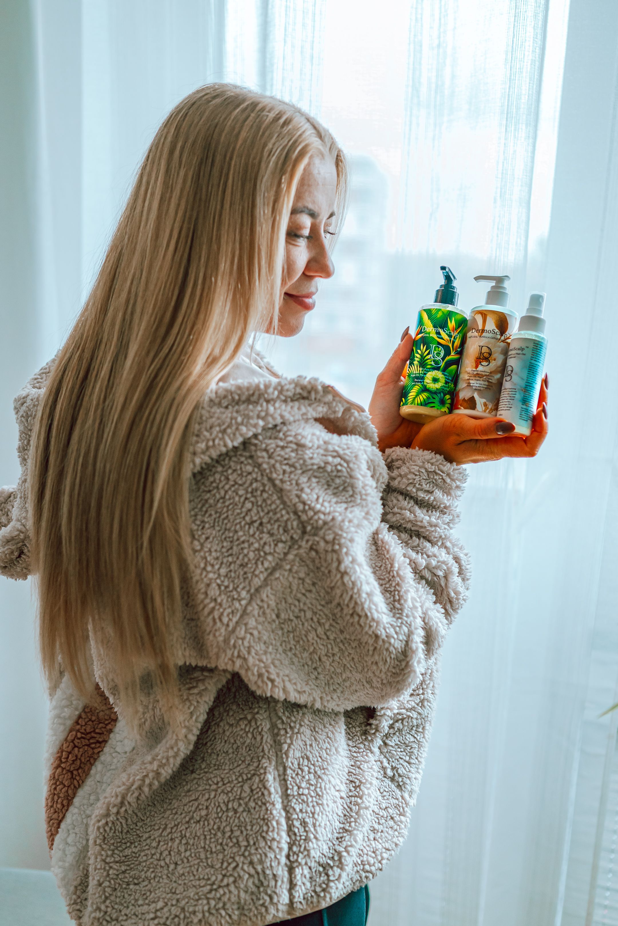 Person wearing cozy white sherpa sweater poses in sequence against bright window with sheer curtains.