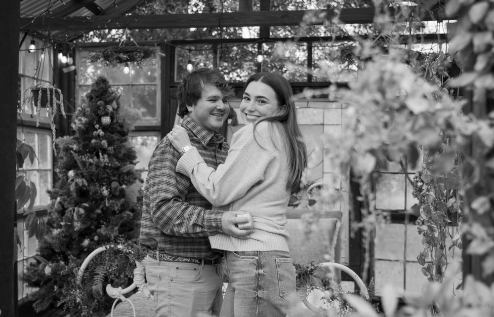 Black and white romantic photos showing tender moments between a couple outdoors.