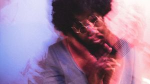 A collage of soft-focus artistic portrait photographs with purple and blue tinted lighting effects.