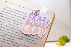 Book spread with colorful stickers including American flag and text designs.