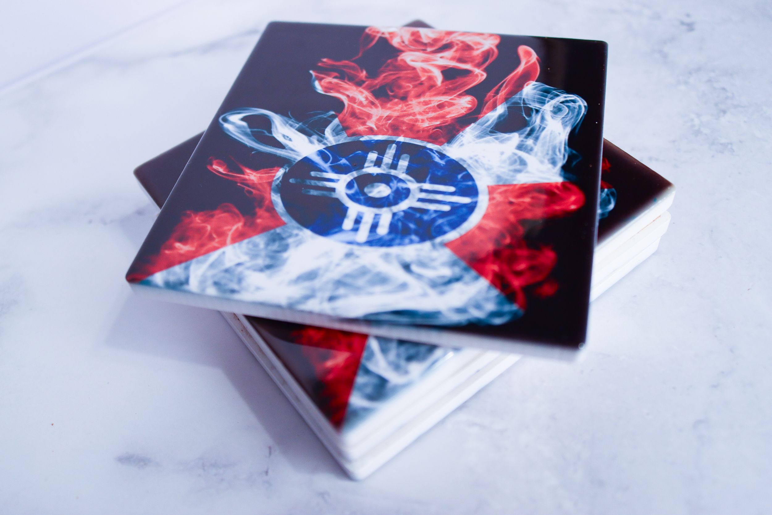 Modern business cards featuring red and blue abstract designs on white surface.