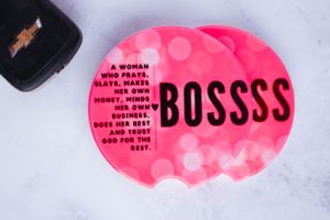 Pink stickers with boss-themed text displayed on light background.