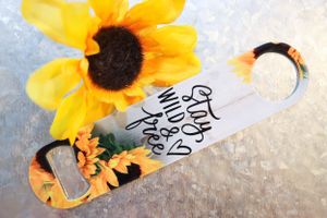 Yellow sunflower with handwritten text on white surface.