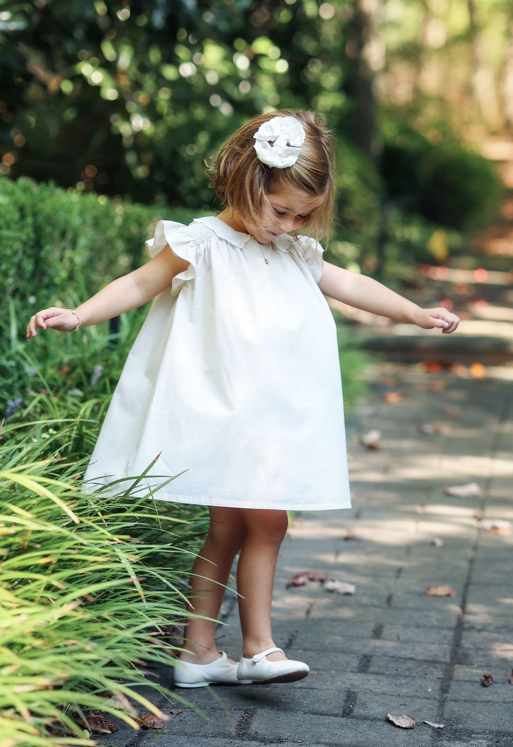 Photo of girl twirling in the spring