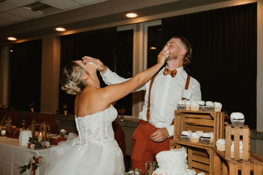 Wedding reception celebration with dancing and festivities in an indoor venue.