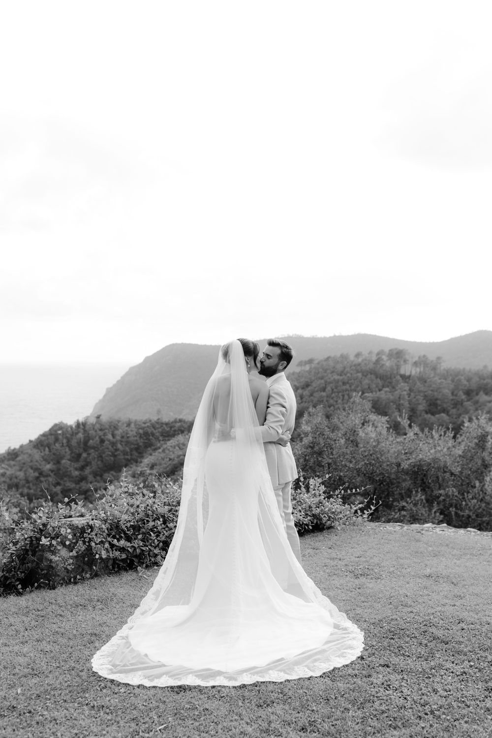Bride and Groom Embracing Against the Cinque Terre Scenery