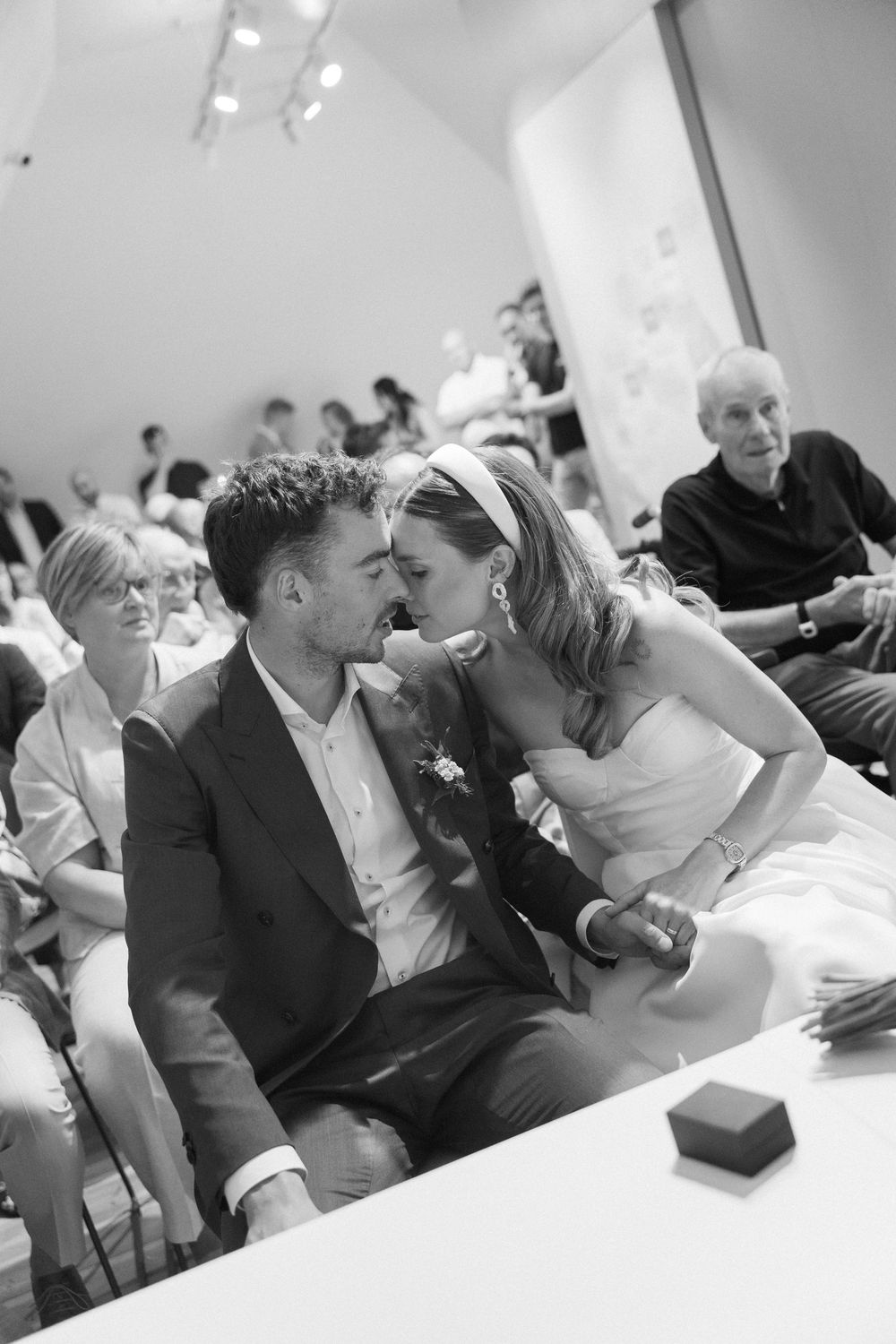 Intimate wedding reception moments captured in black and white photography.