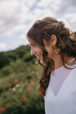 Close-up profile shots showing joyful laughter against a natural outdoor background.