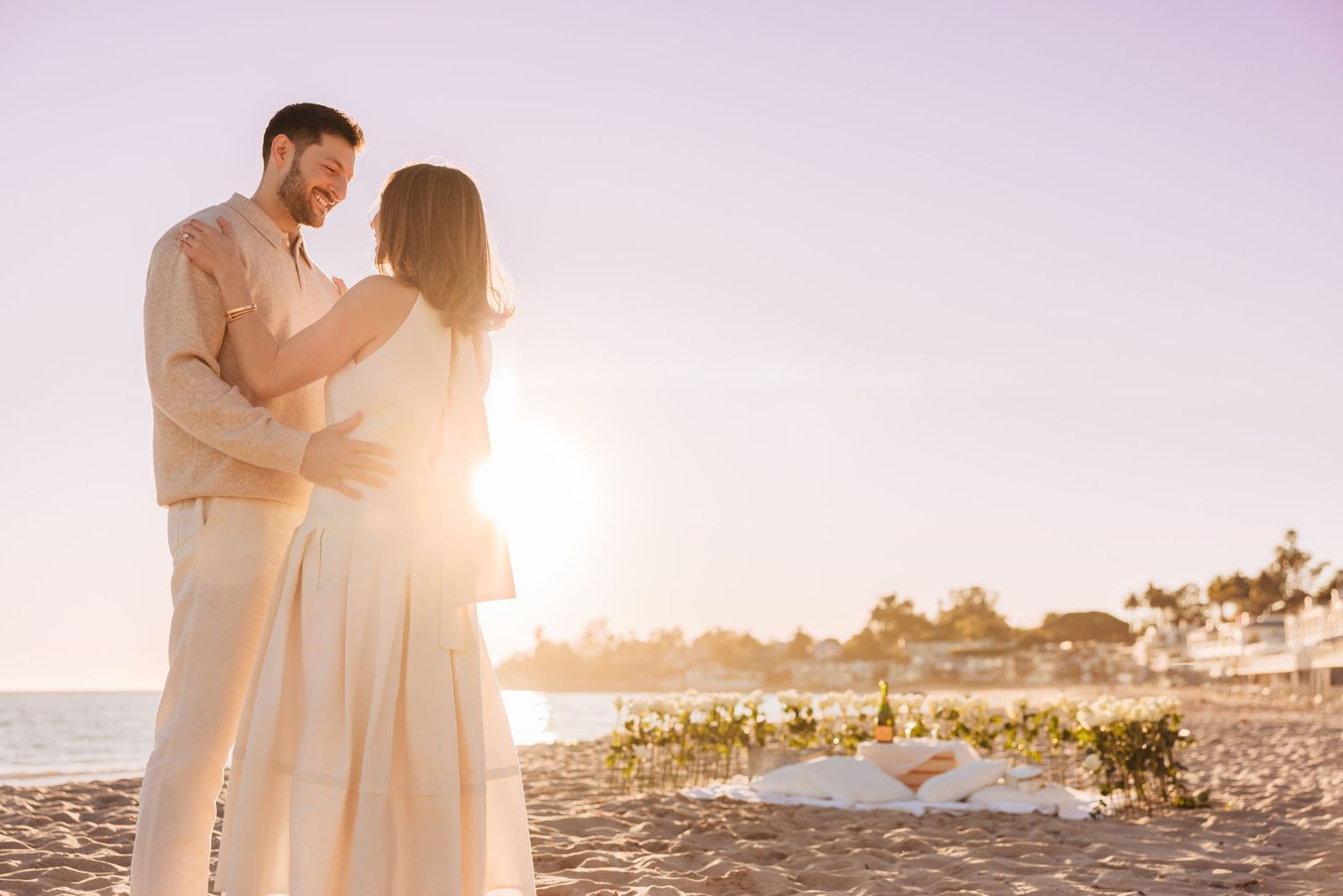Vacationing couple before a surprise proposal at Miramar Beach photographed by a Santa Barbara engagement photographer.