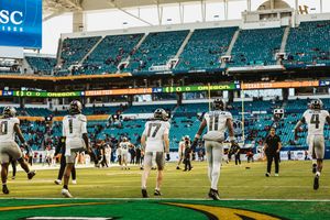 Panoramic view of Hard Rock Stadium field during pre-game activities.