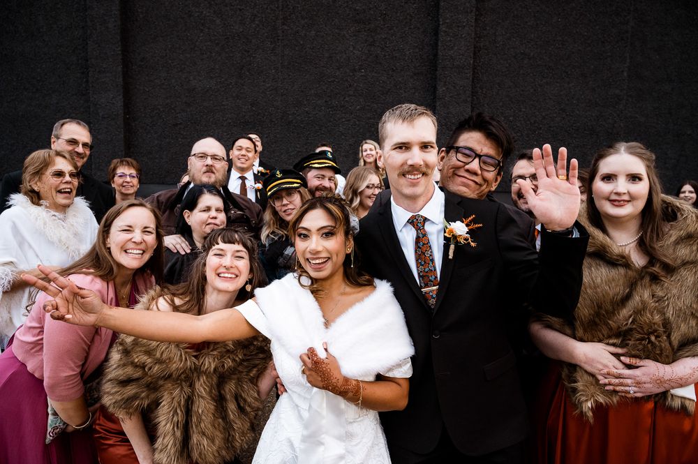 A series of candid wedding photos showing joyful moments between guests and the wedding party against a dark background.