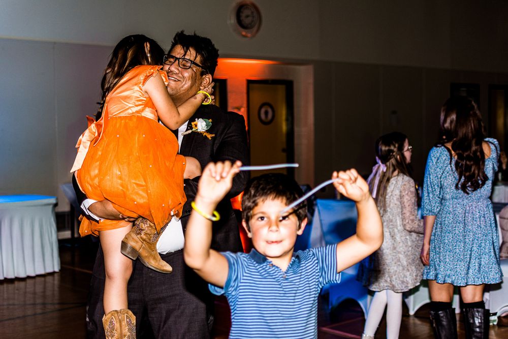 A series of party photos showing people dancing and celebrating in a dimly lit venue with an orange glow.