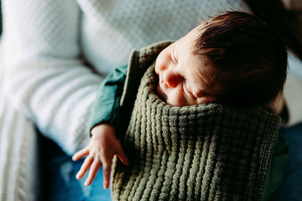 A close-up sequence shows hands gently holding and interacting with a soft knit sweater sleeve.
