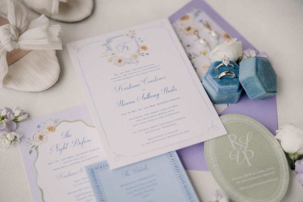 Wedding stationery suite featuring delicate invitations in soft pastel colors with floral accents.