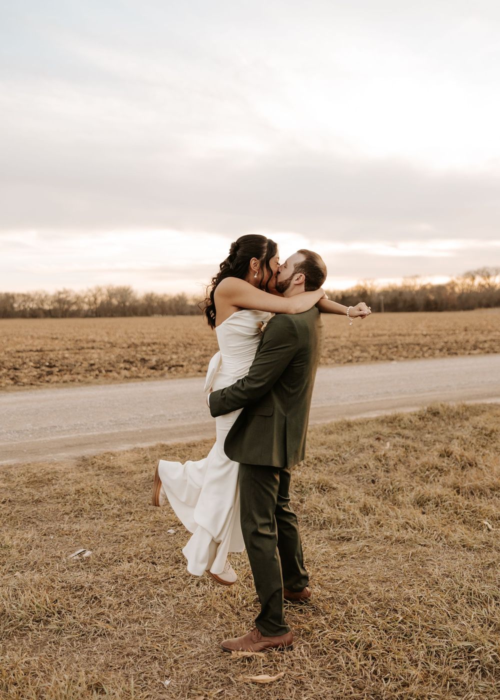 A romantic dance sequence in a golden field during sunset.