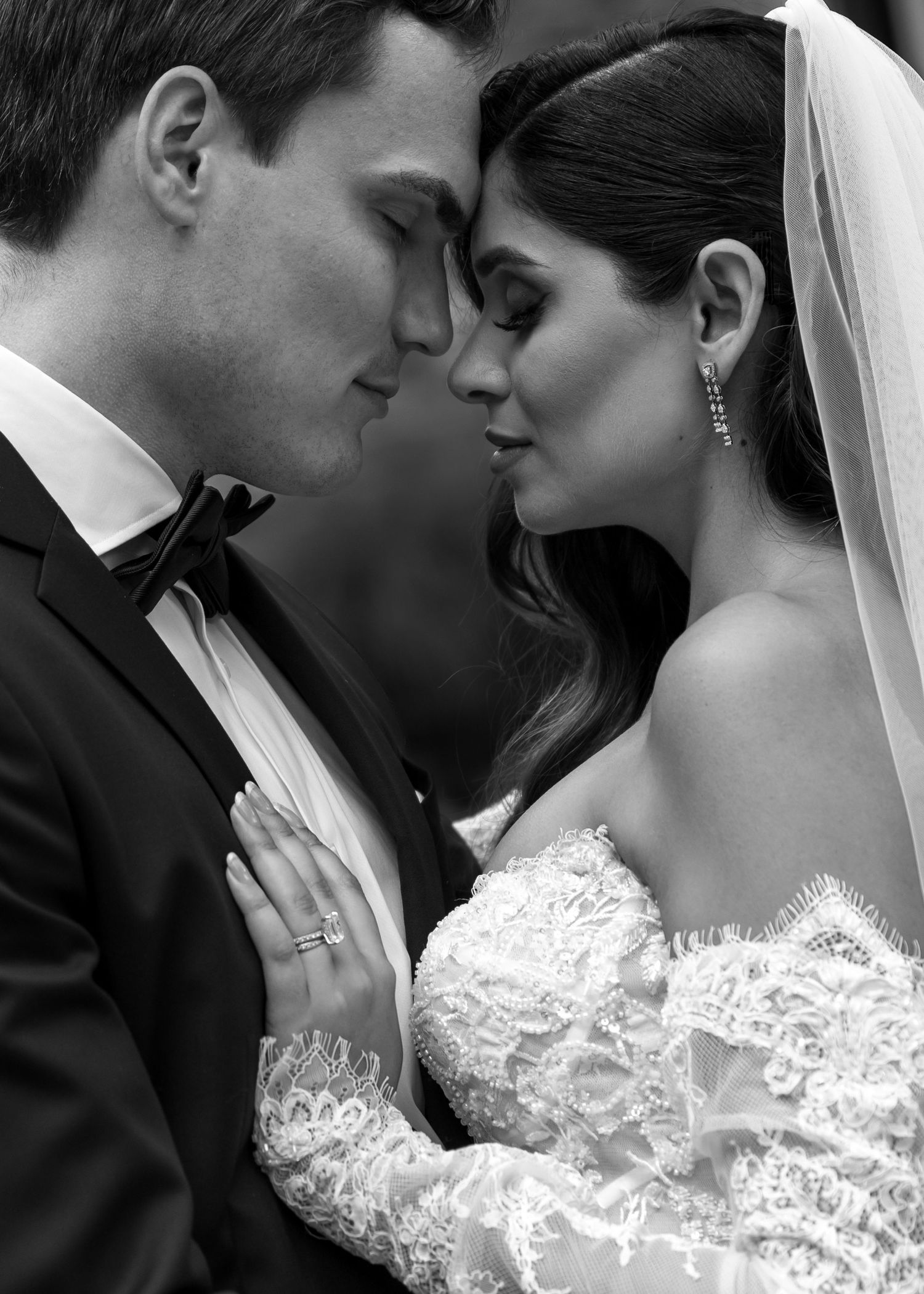 A romantic black and white wedding photo collage showing tender moments between newlyweds.