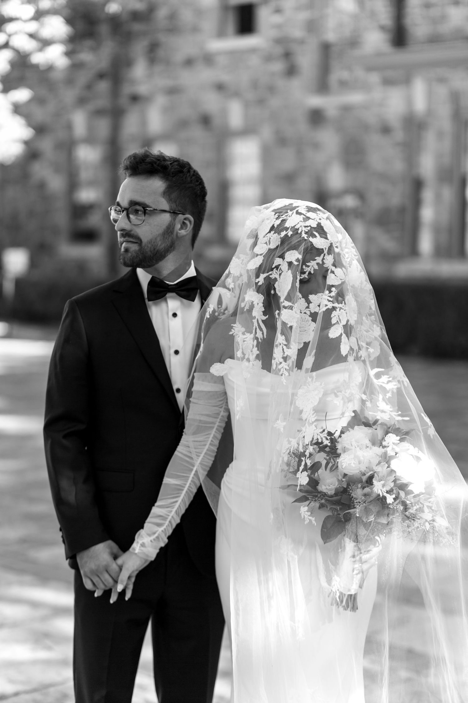 Black and white wedding photo sequence showing romantic moments between a bride and groom in formal attire.