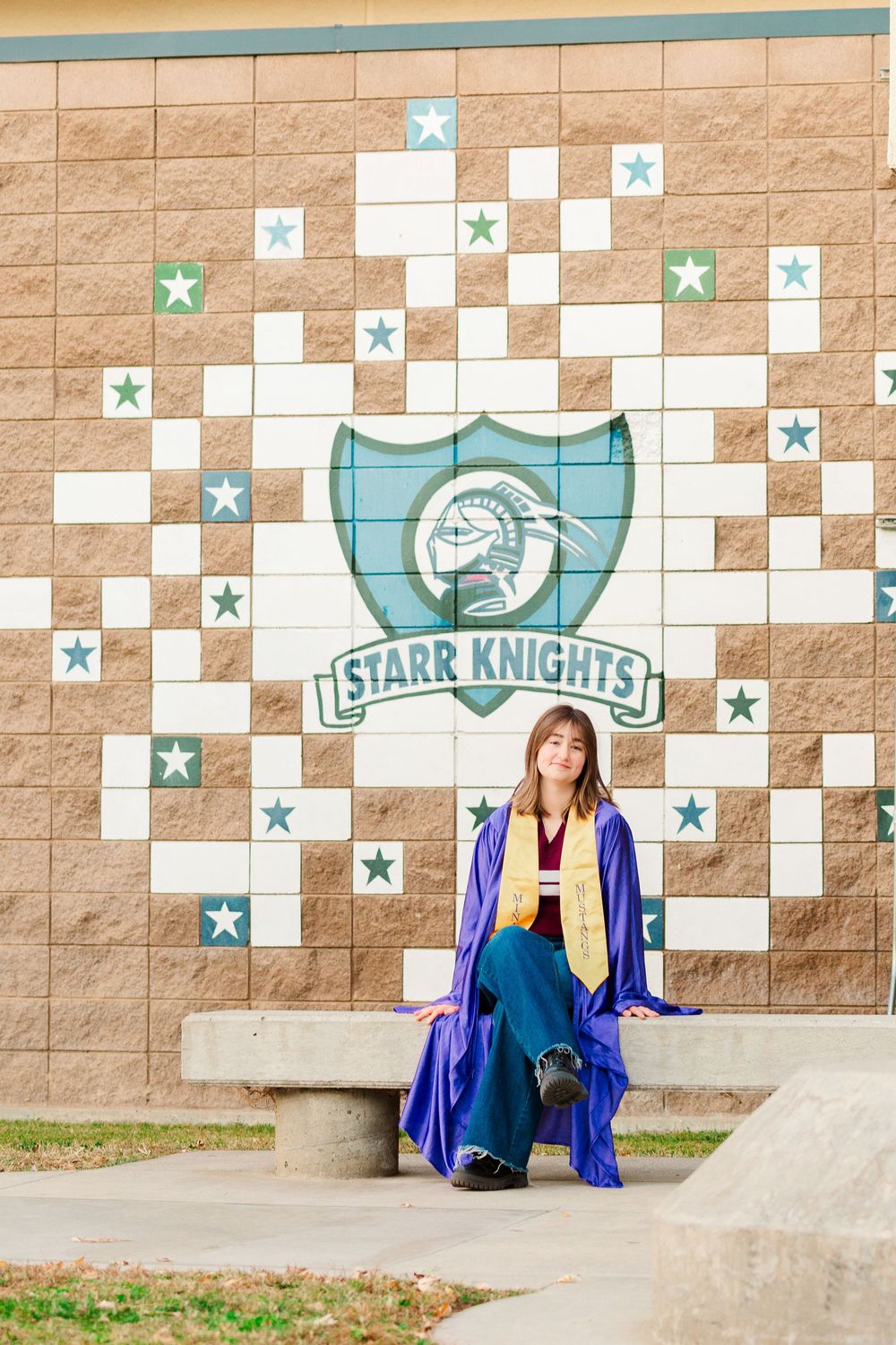 A sequence showing someone posing near a wall decorated with star patterns and a school mascot logo.