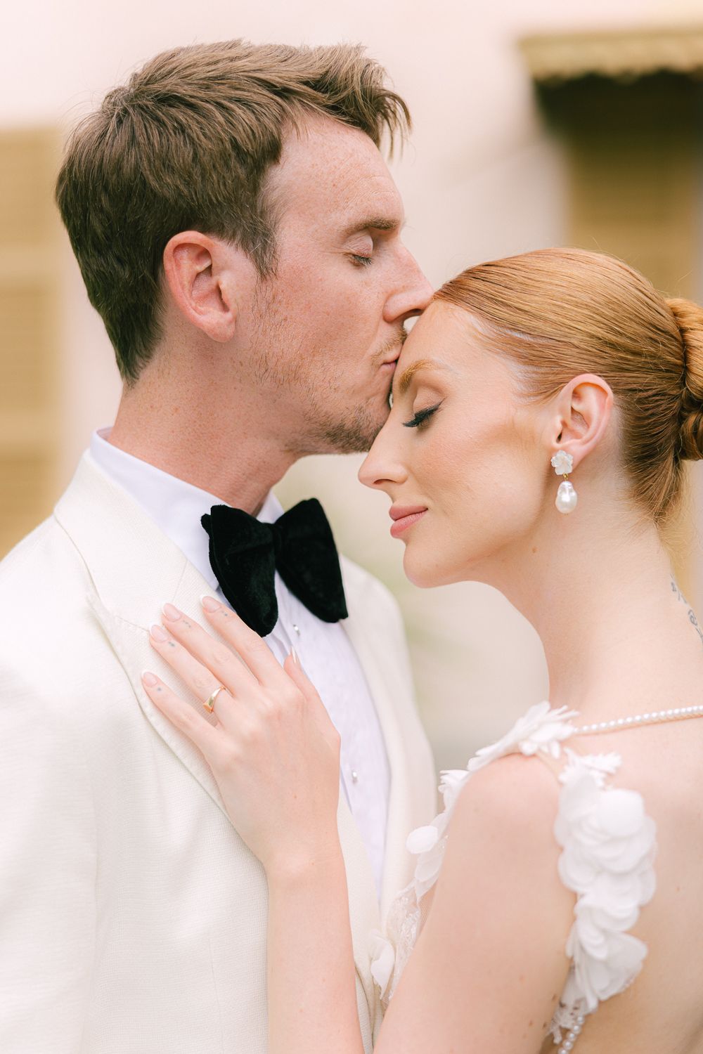 Romantic wedding couple in formal attire sharing intimate moments in a series of close-up portraits.