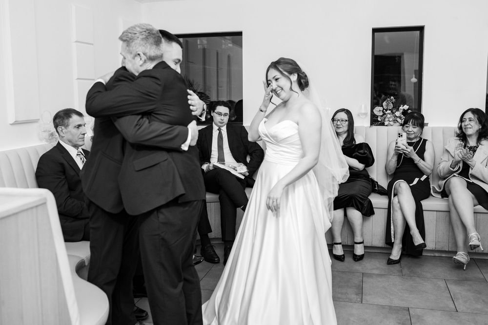 A series of black and white wedding photos showing couples dancing and embracing at a reception celebration.