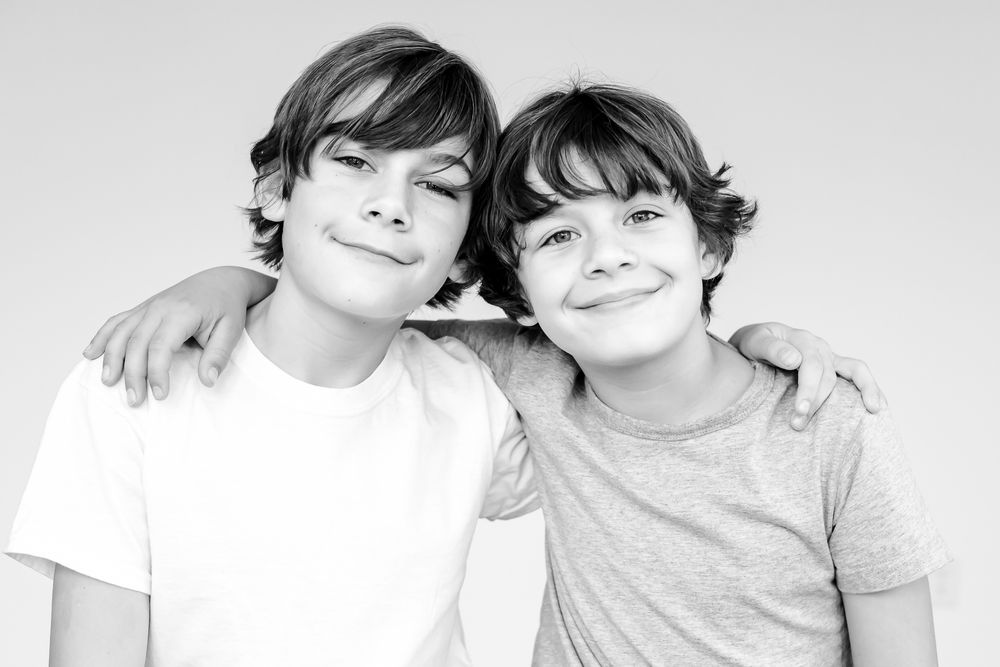 Sibling pair captured in playful black and white kids portrait at Northbrook mini session