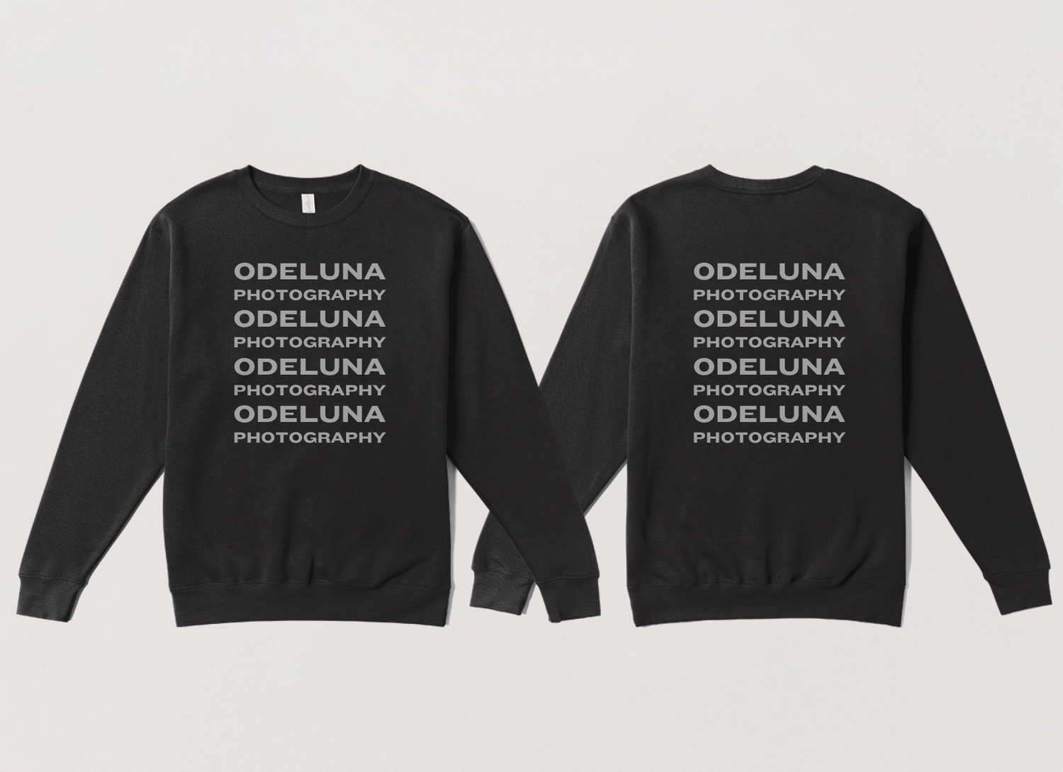 picture of photography merch gray sweatshirt that says odeluna photography repeating down the sweatshirt