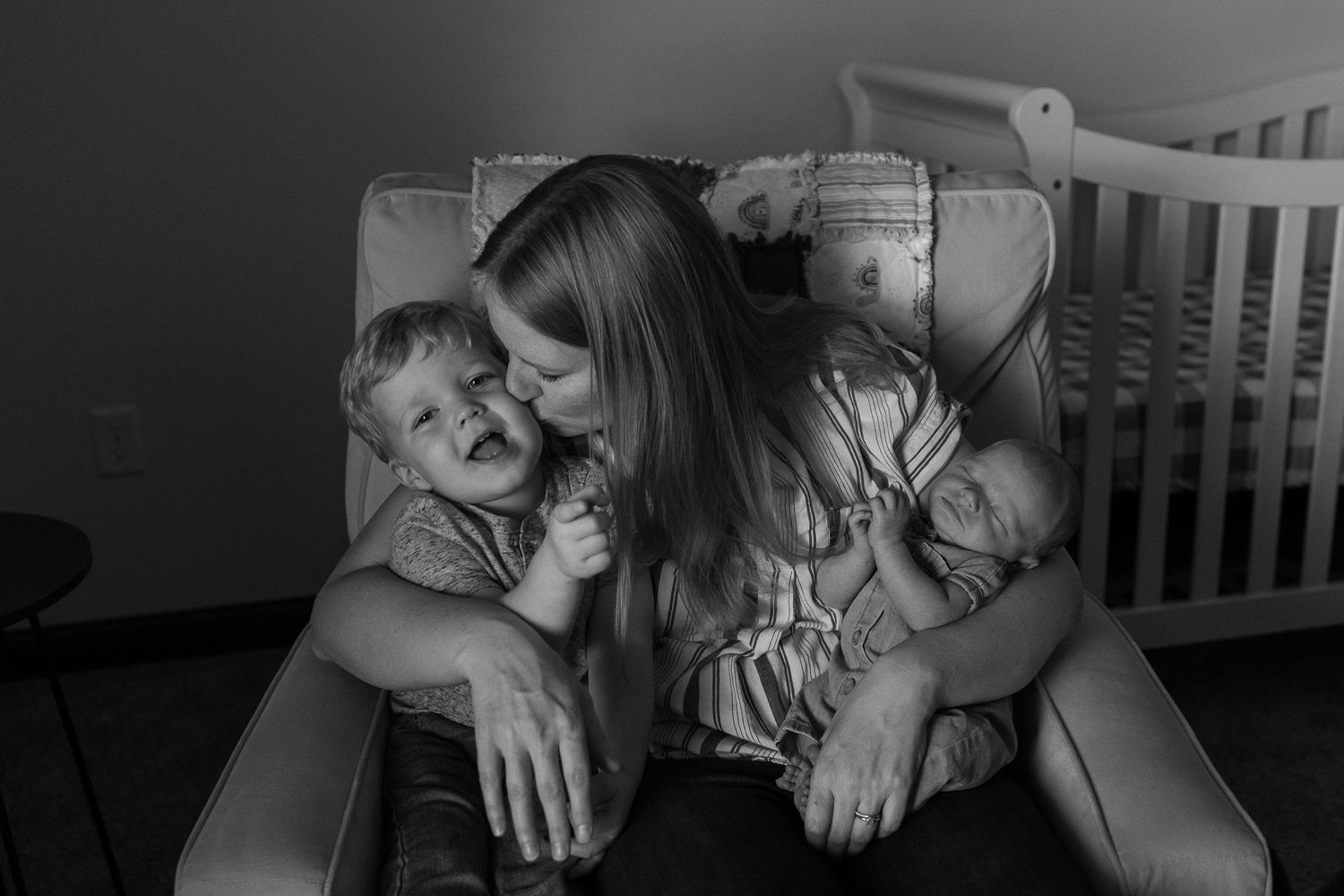 Black and white series of intimate family moments with sleeping baby.