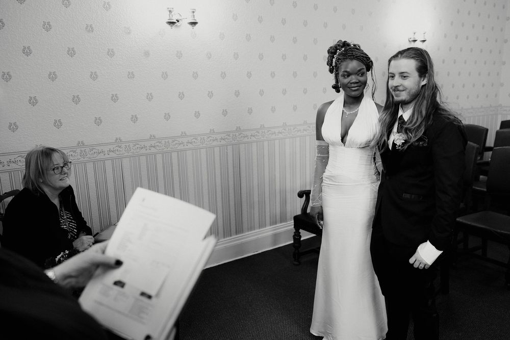 Black and white wedding photographs showing candid moments during a celebration.
